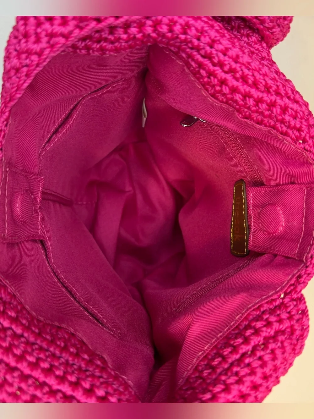 The Sak raspberry, pink handcrafted crochet hobo shoulder bag